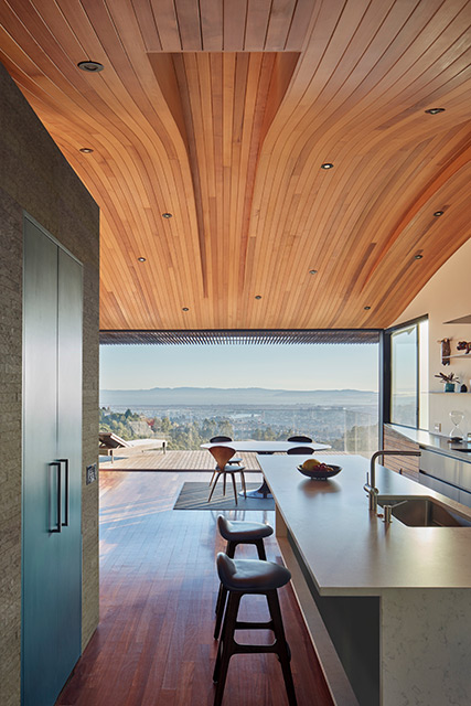Skyline House with Curved Wooden Ceiling in Oakland by Terry & Terry Architecture
