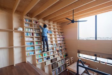 House in Yokohama with Inclined Bookcase Wall by Shinsuke Fujii Architects